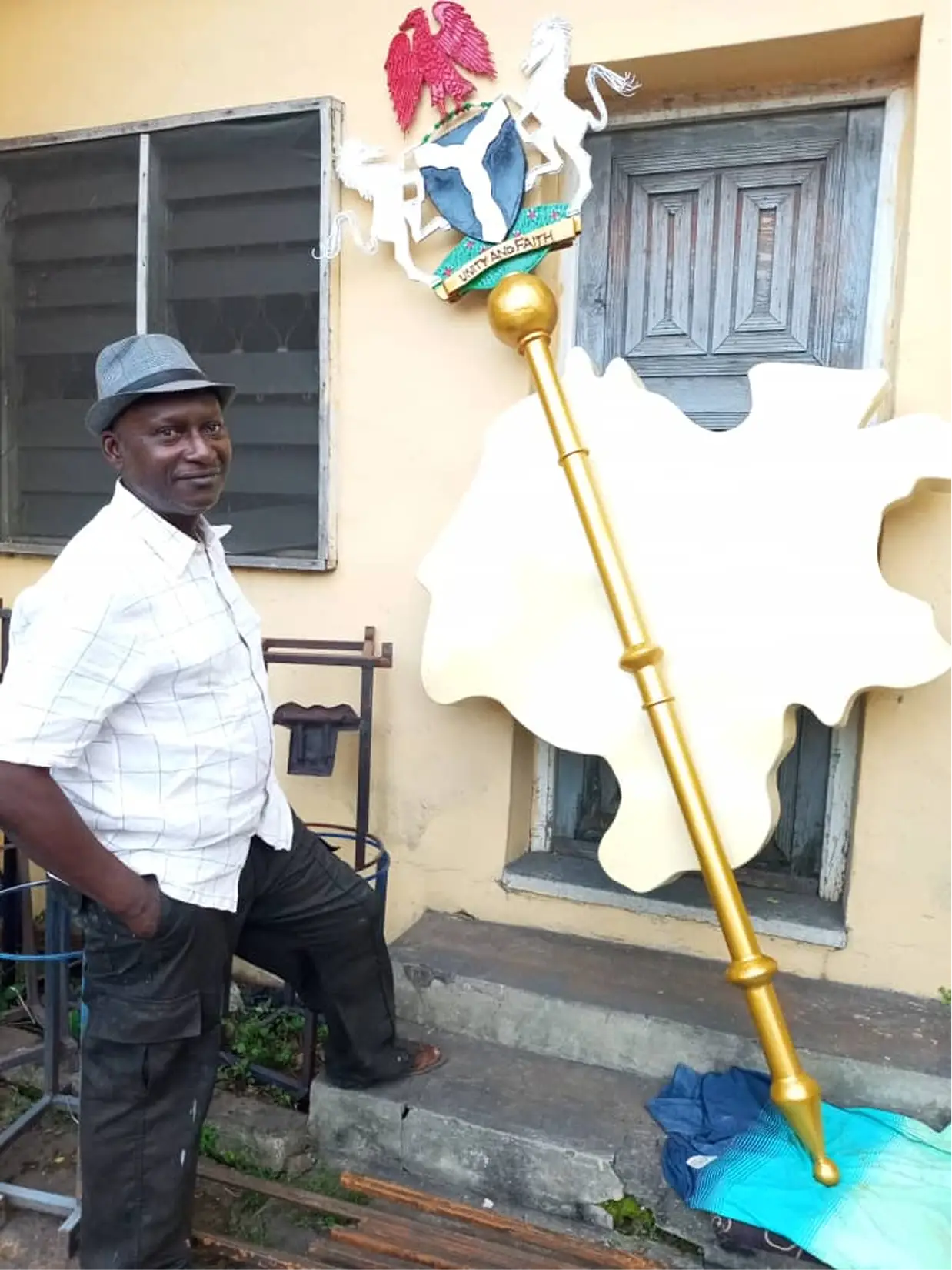 Paul Ejukorlem with a staff